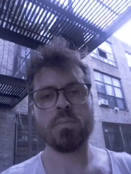 A short looping portrait of Max Bochman, moving from a self-portrait to the street below